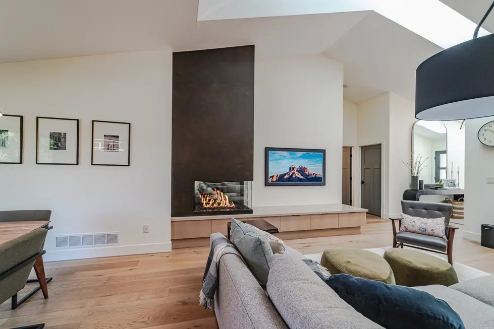 Two-storey fireplace feature wall in a completed Avid Builders living room
